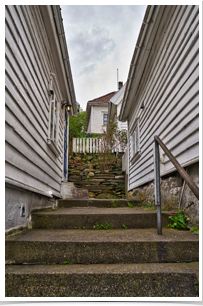 retaining wall holds hill above.